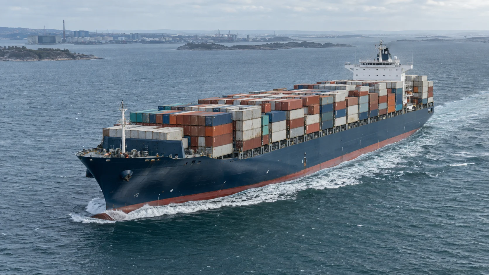 Illustrative cargo vessel underway in a coastal shipping channel